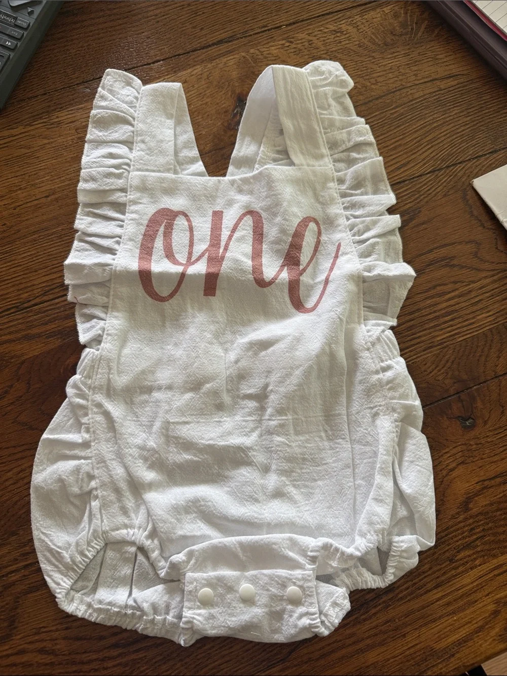 White Ruffled Baby Romper with 'one' Script